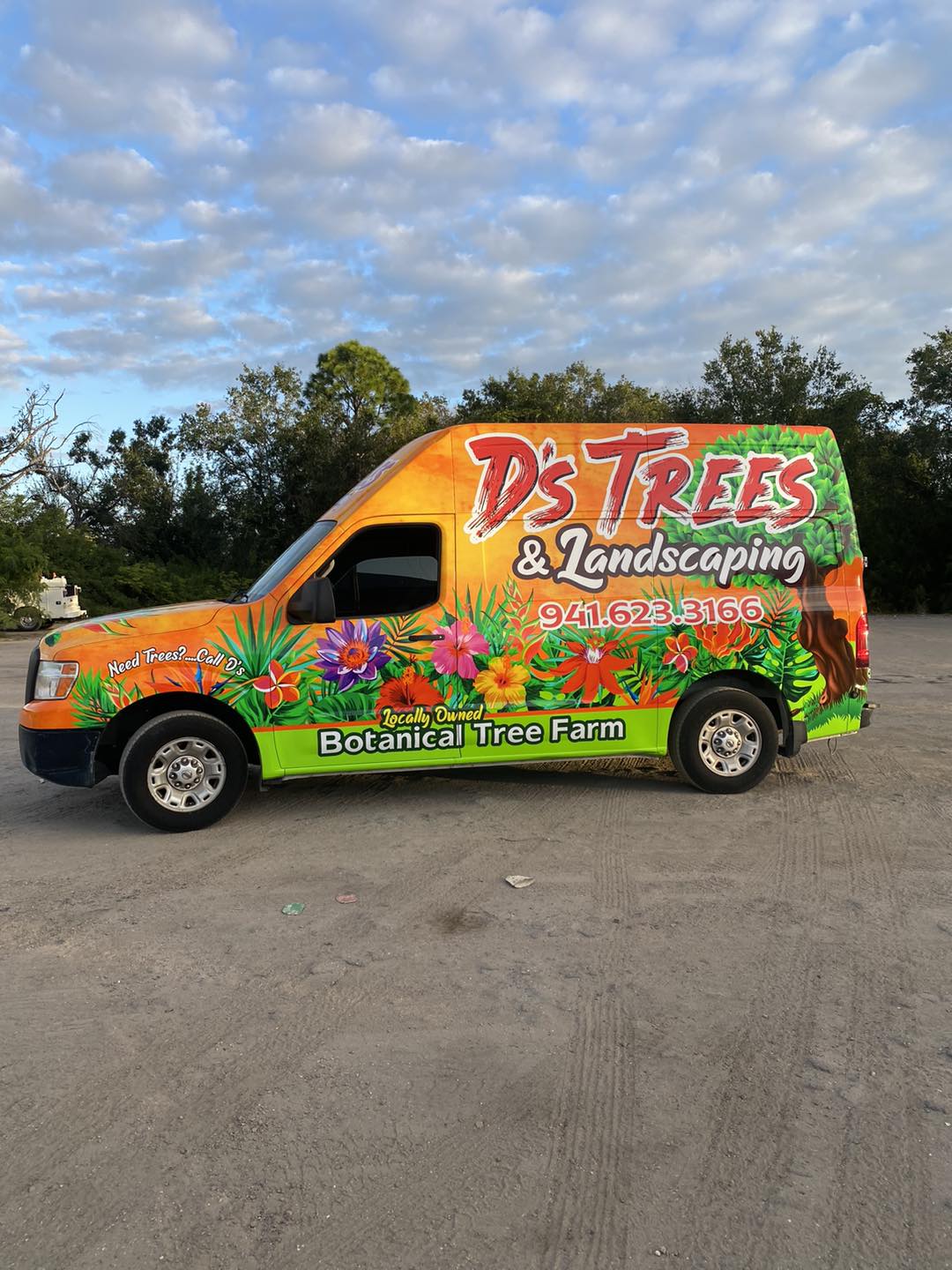 D's Trees crew working with wrapped company truck